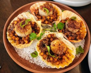 Grilled Japanese scallops with Israeli couscous, sumac, Aleppo compound butter